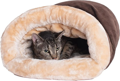 Cat peeking out from a plush, brown and beige pet cave on a white background